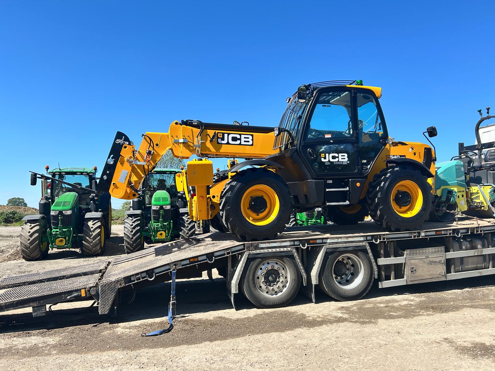 JCB 540-140 construction telehandler loaded on a lorry
